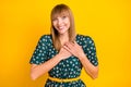 Photo of young cheerful girl happy positive smile hands on chest grateful satisfied isolated over yellow color