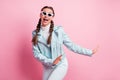 Photo of young cheerful girl happy positive smile have fun enjoy music dance isolated over pastel color background Royalty Free Stock Photo