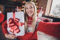 Photo of young cheerful girl happy positive smile make selfie present box winter holiday christmas spirit indoors Royalty Free Stock Photo