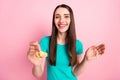 Photo of young cheerful woman happy positive smile feed meal lunch spoon cornflakes tasty isolated over pink color Royalty Free Stock Photo