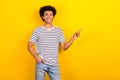 Photo of young confident advertiser guy wear striped t-shirt direct finger mockup open new it offer job isolated on