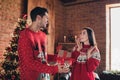 Photo of young couple celebrate new year together boyfriend give his girlfriend gift she surprised indoors xmas decor