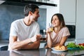 Photo of young couple starting the day together with coffee