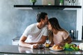 Photo of young couple starting the day together with coffee