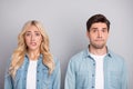 Photo of young couple worried nervous bite lips teeth fail problem anxious isolated over grey color background