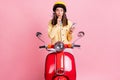 Photo of young curious attractive girl woman pout lips hold phone hand chin isolated on pink colorbackground Royalty Free Stock Photo