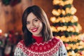 Photo of young cute positive lady toothy beaming smile look you dreamy invite inside her home atmosphere near xmas tree