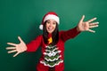 Photo of young cute pretty korean satisfied peaceful lady wear red old ugly sweater tree ornament want hug you isolated