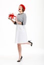 Young cute woman holding gift surprise box.