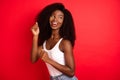 Photo of young excited african girl happy positive smile have fun dance isolated over red color background Royalty Free Stock Photo