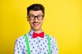 Photo of young excited cheerful man happy positive smile wear glasses cool good mood isolated over yellow color