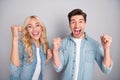 Photo of young excited couple happy positive smile rejoice victory lucky success isolated over grey color background