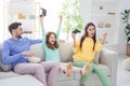 Photo of young excited family happy positive smile mom child excited win competition video game fists hands sit sofa Royalty Free Stock Photo