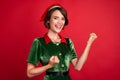 Photo of young excited girl elf happy positive smile celebrate victory holiday isolated over red color background