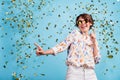 Photo of young excited girl happy positive smile celebrate have fun dance club fall star confetti isolated over blue Royalty Free Stock Photo