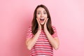 Photo of young excited girl happy positive smile hands touch cheeks amazed news isolated over pink color background