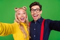 Photo of young excited glamour couple make selfie party 80s theme retro emotion isolated over green color background