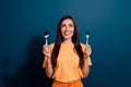 Photo of young excited hungry woman with fork and spoon looking above head fast food restaurant isolated on dark blue