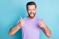Photo of young excited man happy smile show thumbs-up approval excellent choice recommend ad promo isolated over blue