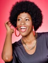 Portrait of young fashionista african american woman wearing red earrings