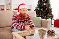 Photo of young focused concentrated handsome ginger man sit sofa playing playstation videogame geek nerd