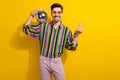 Photo of young friendly man in retro clothing show v sign put disco ball his shoulder during party time isolated on Royalty Free Stock Photo