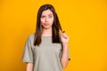 Photo of young funky funny uncertain shocked skeptic unsure girl pout lips pull hair isolated on yellow color background