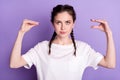 Photo of young funny woman hold hands speak conversation game gesture isolated on purple color background