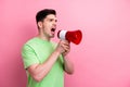 Photo of young furious man bossy screaming loud speaker to empty space announce ukrainian public protest isolated on Royalty Free Stock Photo