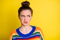 Photo of young girl disgusted dislike bad smell negative refused look empty space isolated over yellow color background