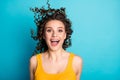 Photo of young girl excited crazy look wind blow hair open mouth have fun wear yellow tank-top isolated blue color