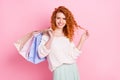 Photo of young girl happy positive smile hold shopping bags boutique consumerism isolated over pink color background