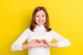 Photo Of Young Girl Happy Positive Smile Show Fingers Heart Figure Love Feelings  Over Yellow Color Background