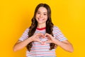 Photo of young girl happy positive smile show fingers heart symbol love like valentine day over yellow color