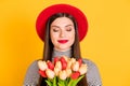 Photo of young girl happy smile dream enjoy present flower bouquet holiday tulips isolated over yellow color background