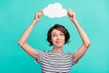 Photo of young girl hold paper cloud advertise weather rain isolated over turquoise color background