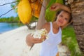 Photo young girl relaxing on beach with flowers. Smiling woman spending chill time outdoor summer Bali island Royalty Free Stock Photo