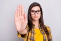 Photo of young girl unhappy negative show hand no stop reject block sign isolated over grey color background