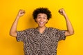 Photo of young guy fists up hooray finally his weekend starts holidays vacation wear stylish shirt isolated on yellow