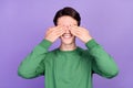 Photo of young guy happy positive smile close cover eyes hands hide peek isolated over violet color background