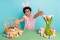 Photo of young guy spring feast easter holiday embrace you bunny headband fresh tulips colored eggs bucket isolated on Royalty Free Stock Photo