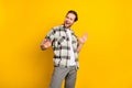 Photo of young handsome man happy positive smile have fun dance isolated over yellow color background Royalty Free Stock Photo