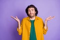 Photo of young handsome unsure uncertain puzzled man male guy hold hands don't know isolated on purple color background