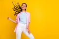 Photo of young happy afro american woman fly hair blow wind smile empty space isolated on yellow color background