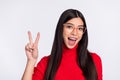 Photo of young happy excited charming woman in glasses showing v-sign isolated on grey color background Royalty Free Stock Photo