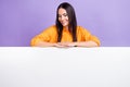 Photo of young happy girl wear stylish shirt folded hands over placard looking new job offers website isolated on purple Royalty Free Stock Photo