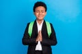 Photo of young happy positive cheerful afro american boy pray ask please wish isolated on blue color background