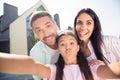 Photo of young happy positive smiling cheerful family take selfie daughter pout lips mom and dad stick tongues out Royalty Free Stock Photo