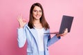 Photo of young happy smile girl hold laptop show okey deal done cool sign isolated over pastel color background