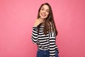 Photo of young happy smiling positive beautiful brunette woman with sincere emotions wearing casual striped pullover Royalty Free Stock Photo